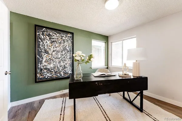 a bathroom with a toilet sink vanity and mirror