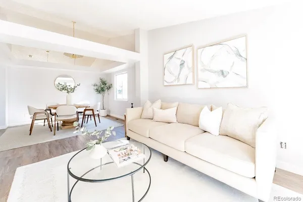 a living room with furniture and a table