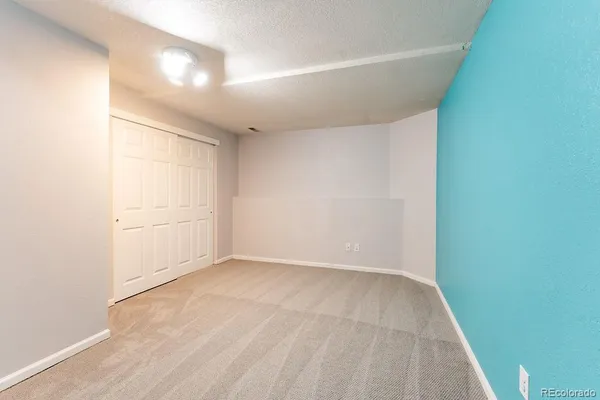 a view of road with card parked on side and road