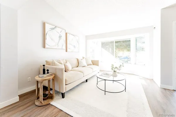 a living room with furniture and a table