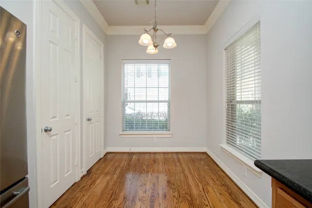 a view of a kitchen with a refrigerator a microwave oven a sink and dishwasher