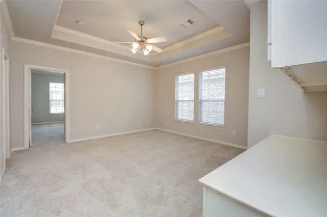 en view interior of a house a ceiling fan and windows