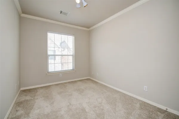 a view of an empty room and closet area