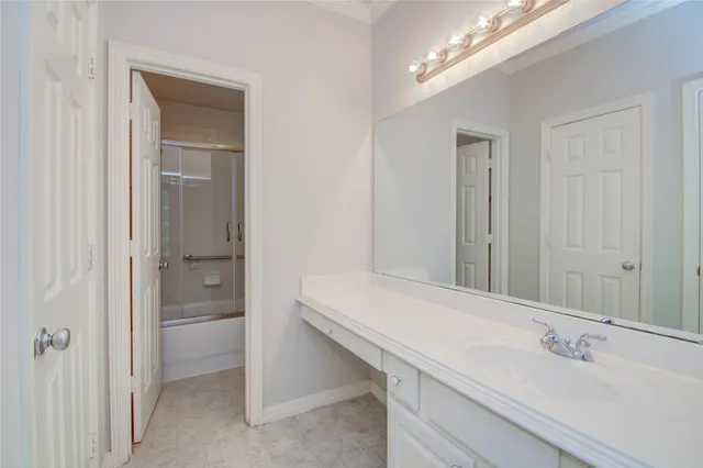 a white toilet sitting next to a bath tub