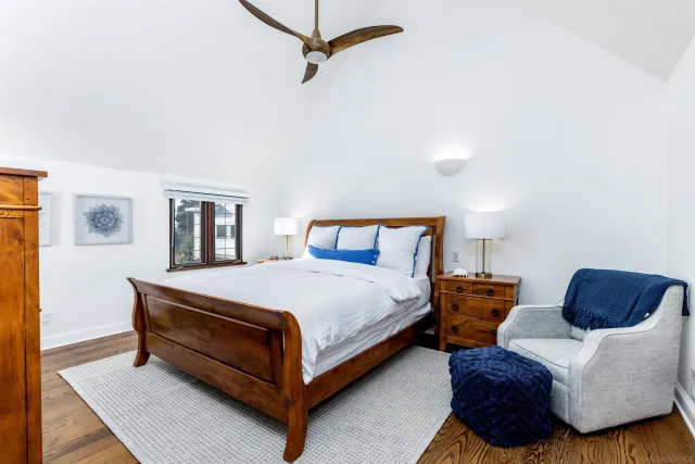 a bedroom with bed and a window