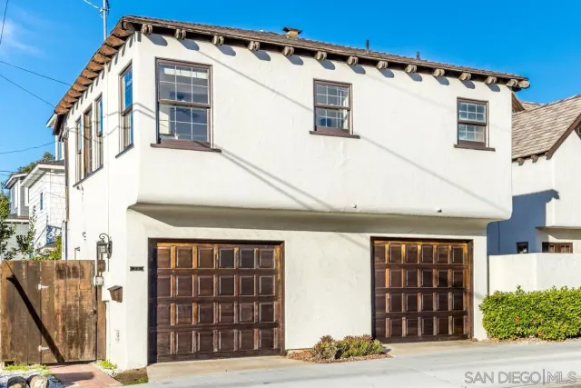 a front view of a house with a garage