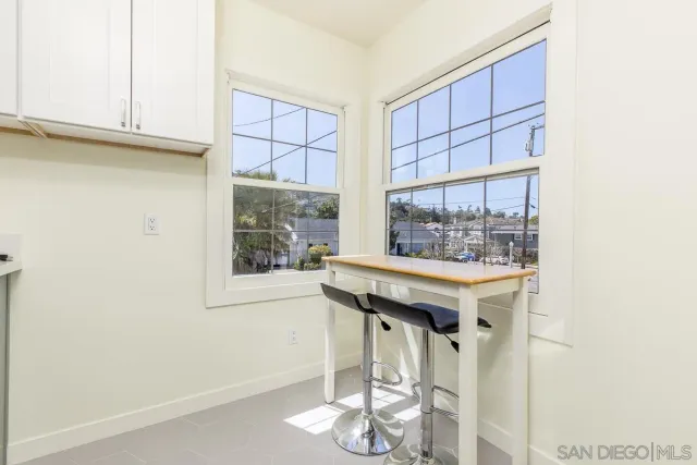 a room with a table and chairs