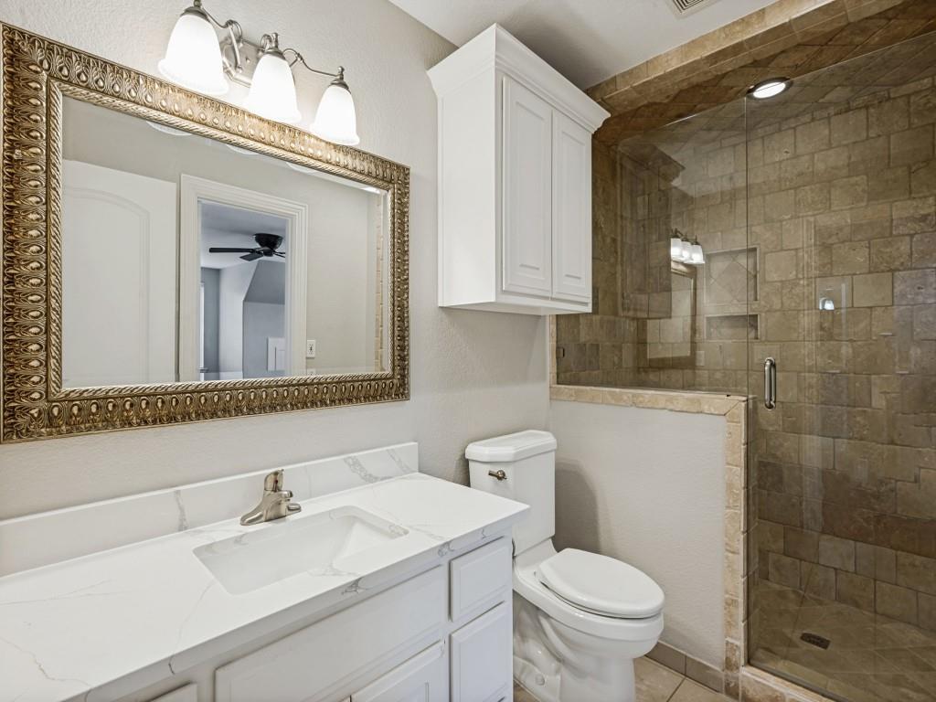 5975 Diamond Spur Frisco, TX 75036 - Photo 28 of 40 a bathroom with a sink a toilet and mirror