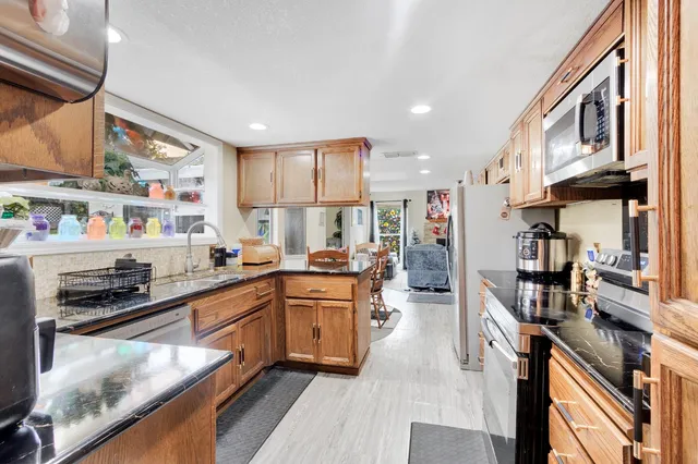 a living room with furniture and flowers