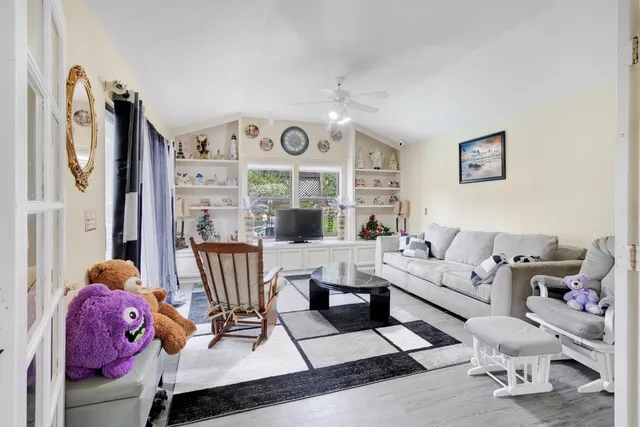 a living room with furniture and a large window