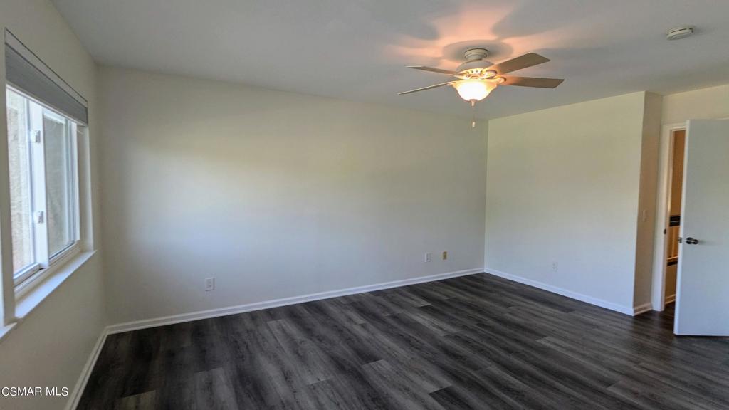 2501 Radford Court Simi Valley, CA 93063 - Photo 12 of 21 an empty room with wooden floor and windows