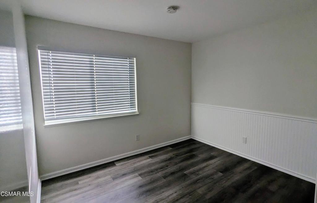 2501 Radford Court Simi Valley, CA 93063 - Photo 15 of 21 an empty room with wooden floor and a window
