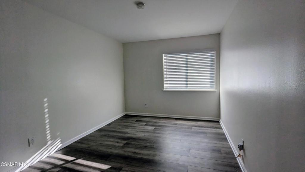 2501 Radford Court Simi Valley, CA 93063 - Photo 16 of 21 an empty room with wooden floor and windows