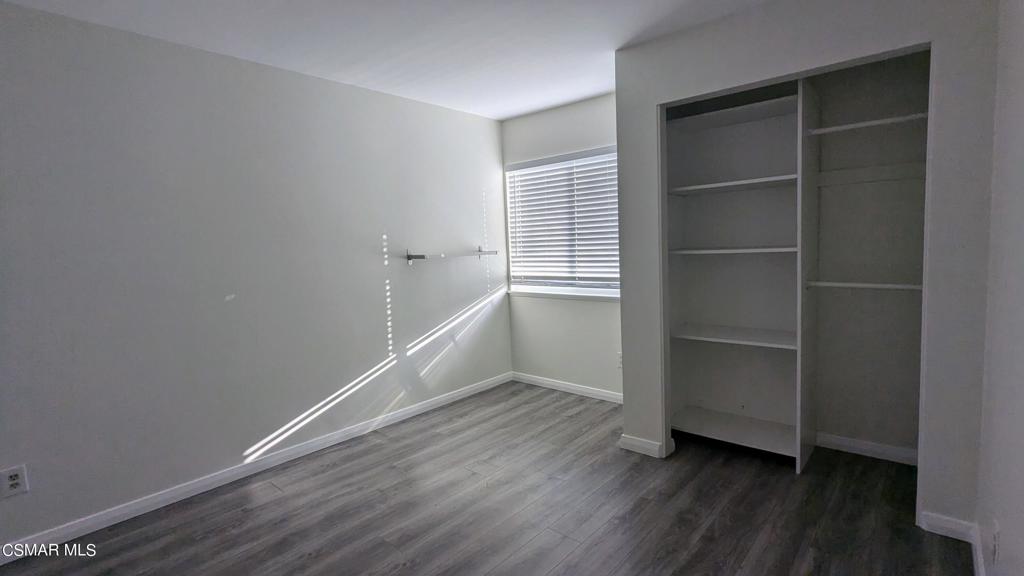 2501 Radford Court Simi Valley, CA 93063 - Photo 17 of 21 a view of an empty room with wooden floor and window