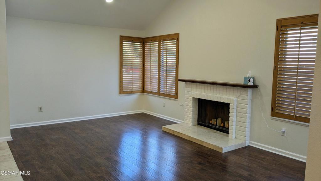 2501 Radford Court Simi Valley, CA 93063 - Photo 4 of 21 a view of an empty room with wooden floor and a window