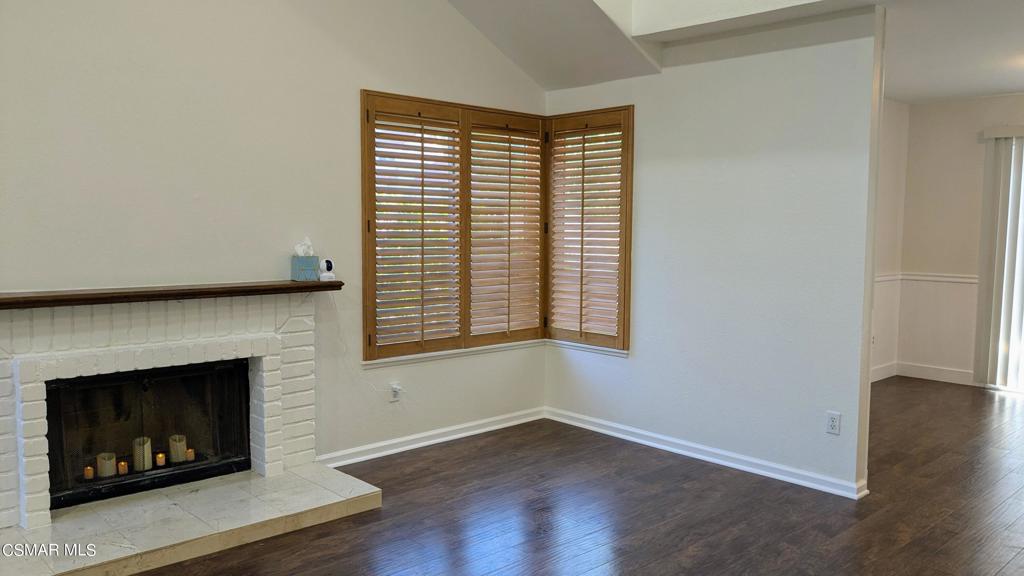 2501 Radford Court Simi Valley, CA 93063 - Photo 5 of 21 a view of an empty room with wooden floor and a fireplace