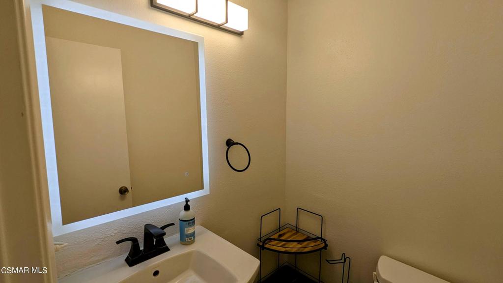 2501 Radford Court Simi Valley, CA 93063 - Photo 10 of 21 a bathroom with a sink and a mirror