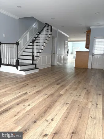 a view of a hallway with stairs