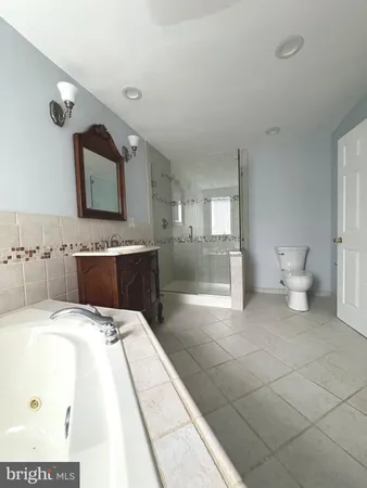 a bedroom with a large bed and a table