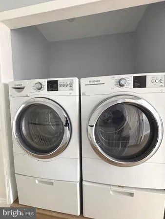 a utility room with dryer and washer