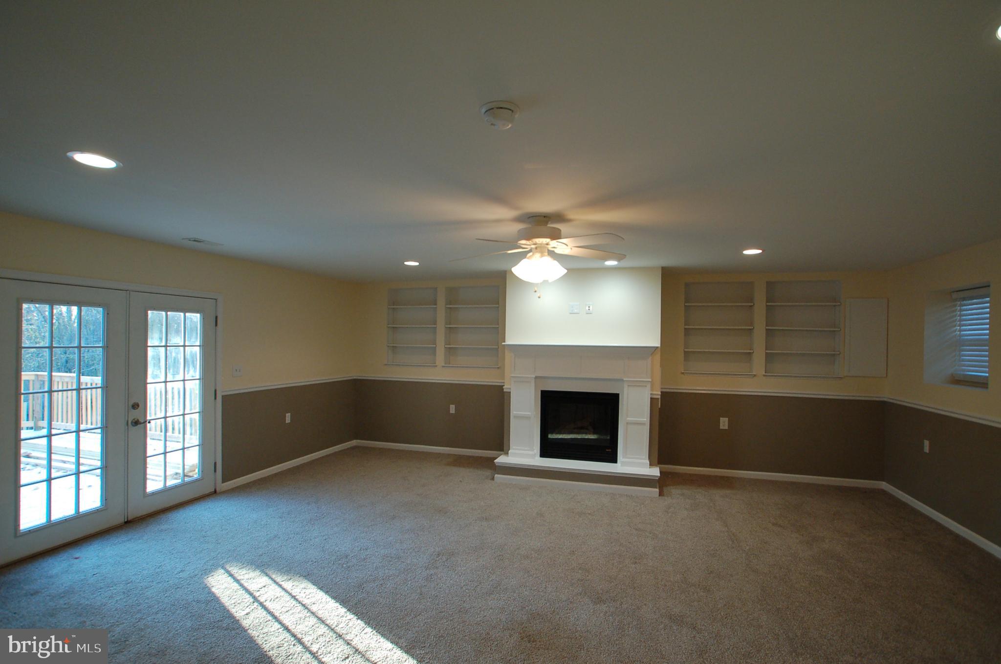 8275 Sycamore Road Lusby, MD 20657 - Photo 11 of 19 Family room with access to deck - 20' x 22'2"