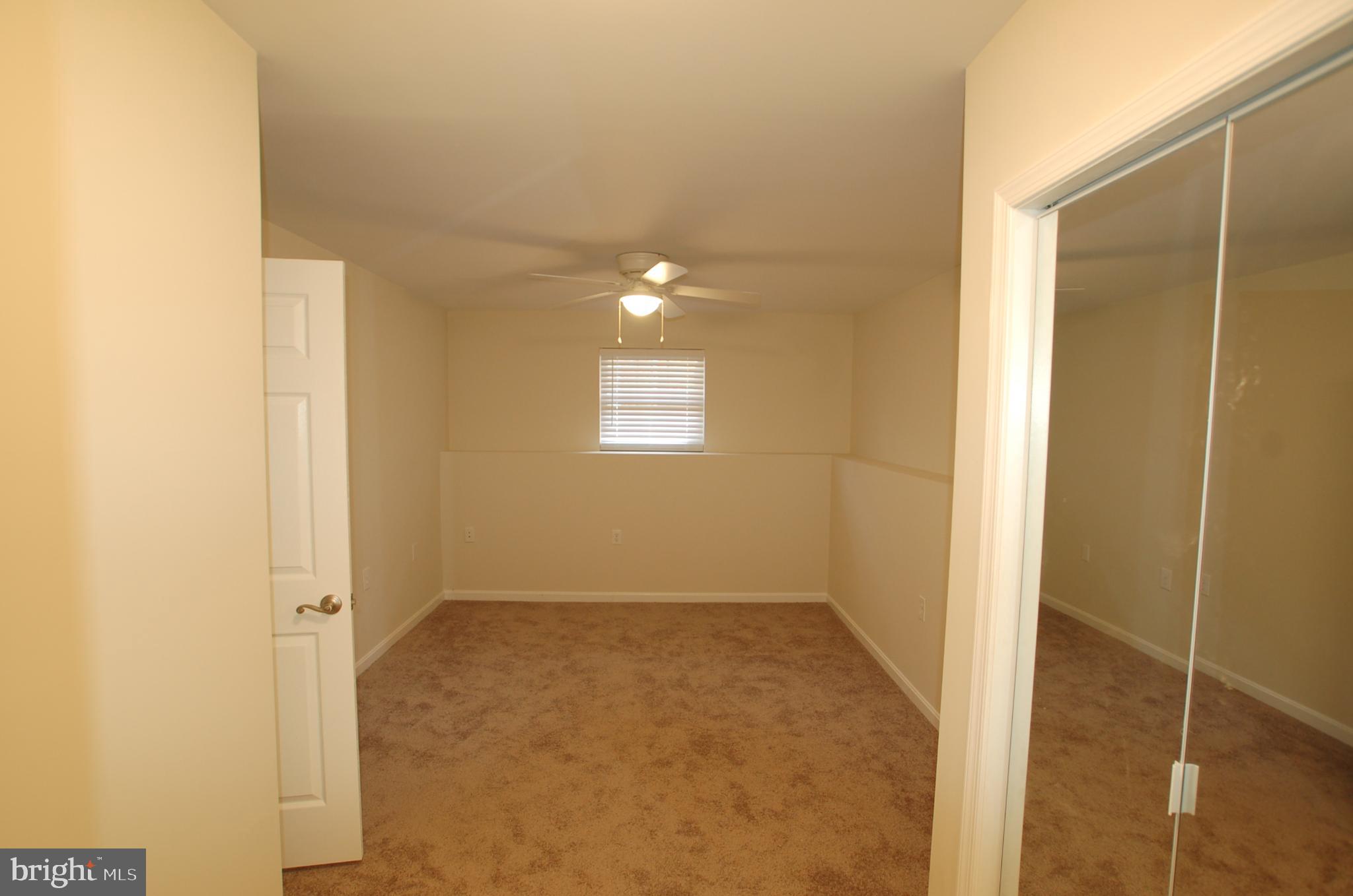 8275 Sycamore Road Lusby, MD 20657 - Photo 13 of 19 Bedroom 4 on lower level - 10'5" x 12'