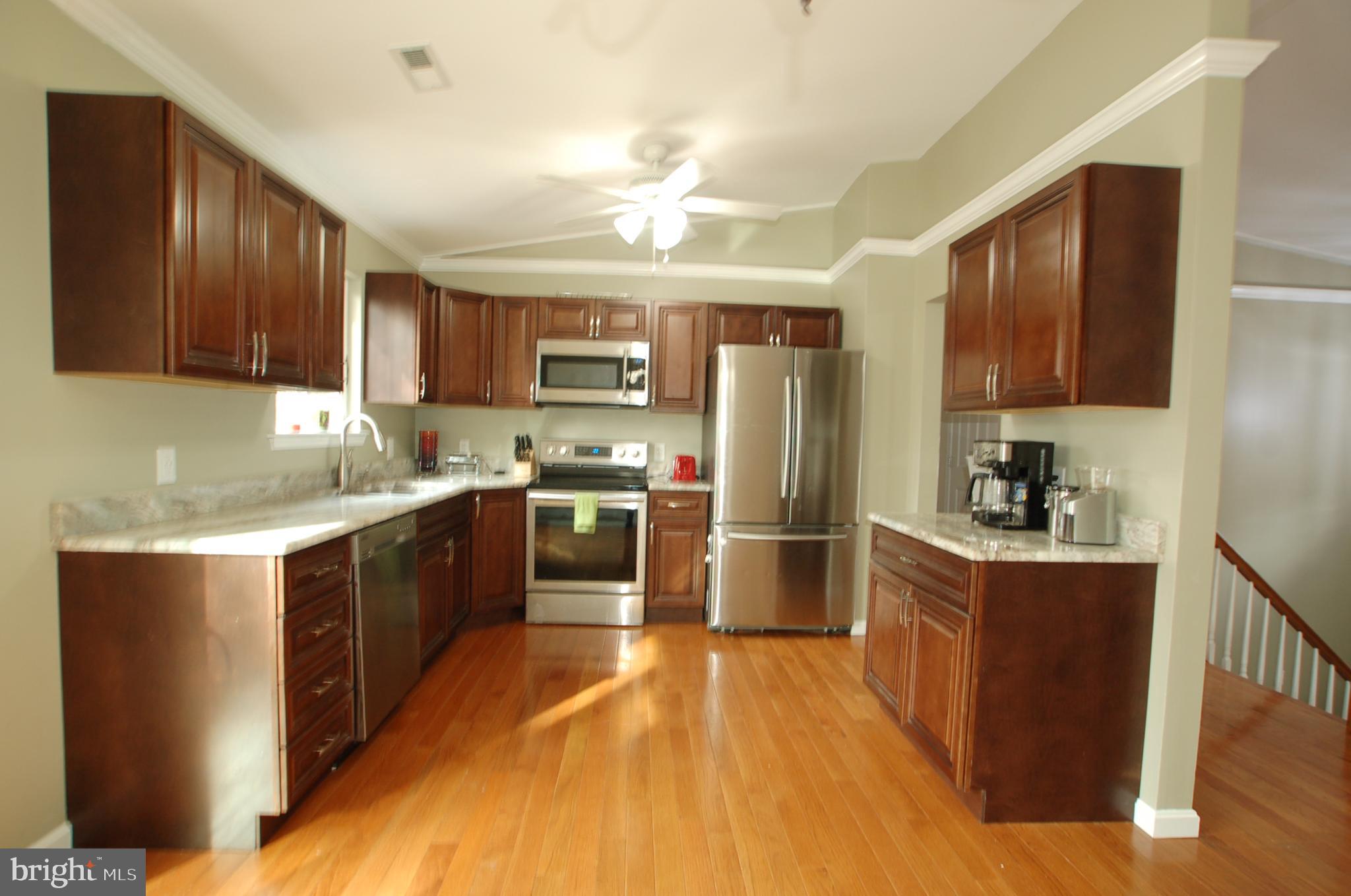 8275 Sycamore Road Lusby, MD 20657 - Photo 4 of 19 Kitchen with SS appliances and granite countertops