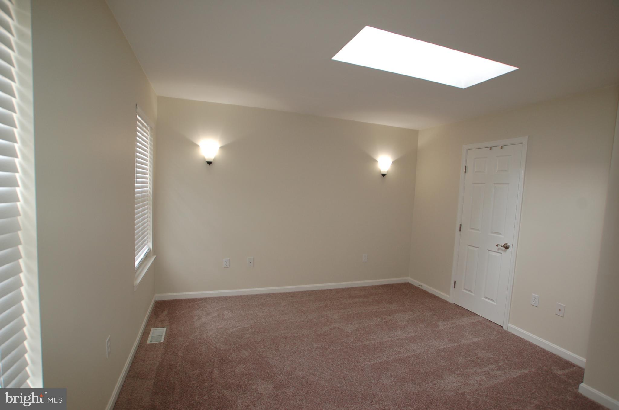 8275 Sycamore Road Lusby, MD 20657 - Photo 9 of 19 Master bedroom with walk-in closet - 12'2" x 12'4"