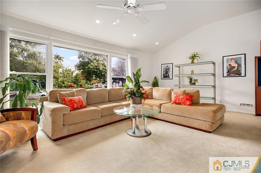 5 Steelox Road East Brunswick, NJ 08816 - Photo 1 of 24 a living room with furniture and a large window