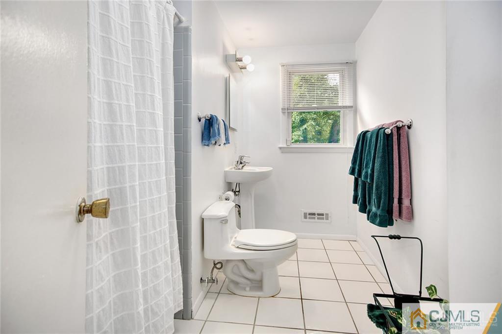 5 Steelox Road East Brunswick, NJ 08816 - Photo 12 of 24 a bathroom with a toilet and a shower