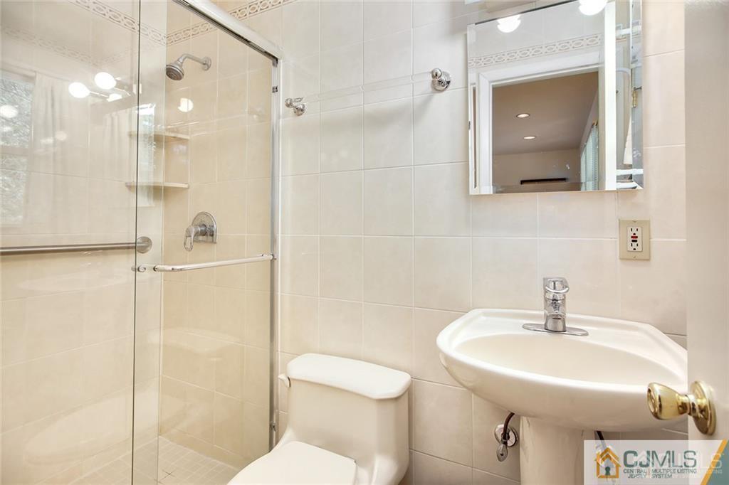 5 Steelox Road East Brunswick, NJ 08816 - Photo 16 of 24 a bathroom with a sink toilet and shower