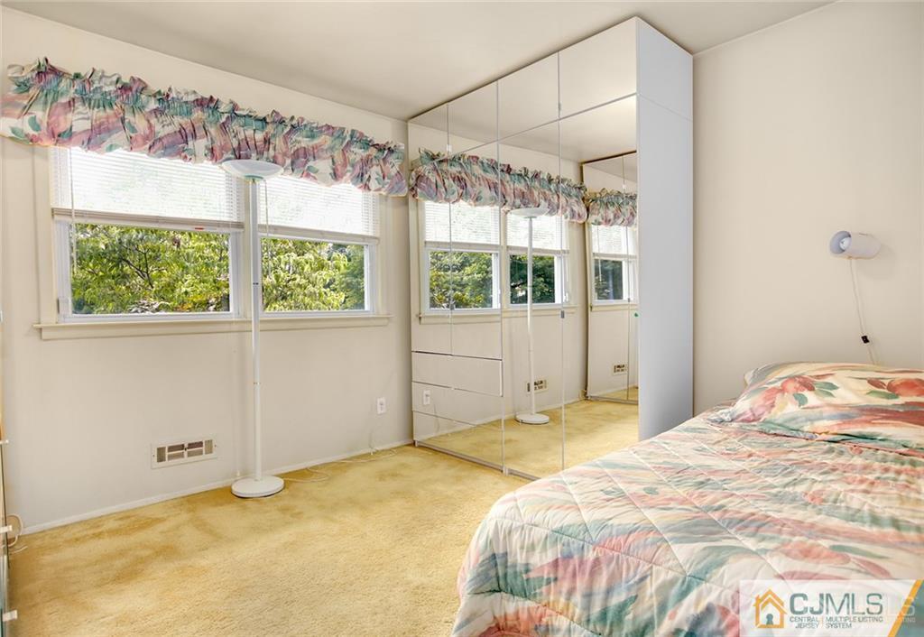 5 Steelox Road East Brunswick, NJ 08816 - Photo 17 of 24 a bedroom with a bed and a window