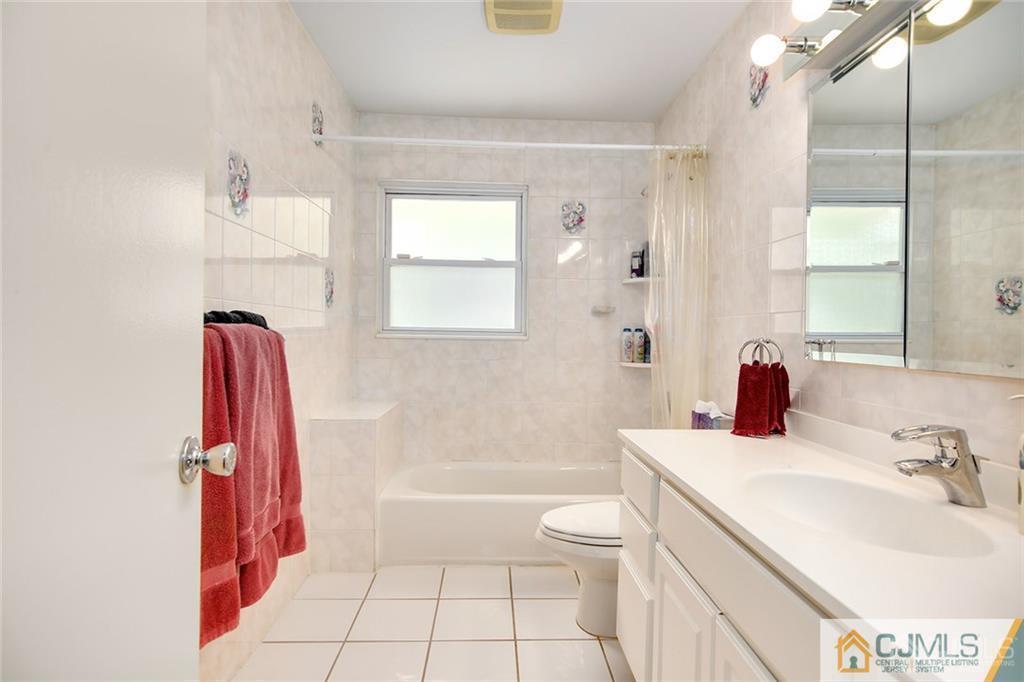 5 Steelox Road East Brunswick, NJ 08816 - Photo 19 of 24 a bathroom with a sink a toilet and shower