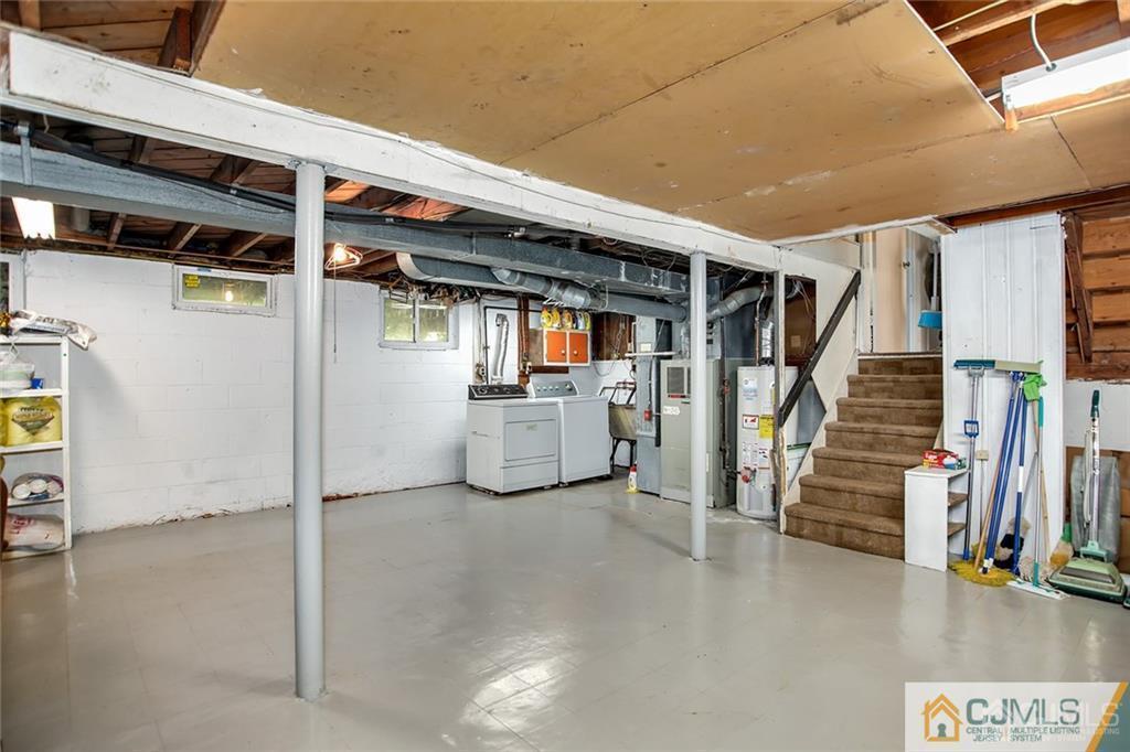 5 Steelox Road East Brunswick, NJ 08816 - Photo 20 of 24 a view of a livingroom with wooden floor and stairs
