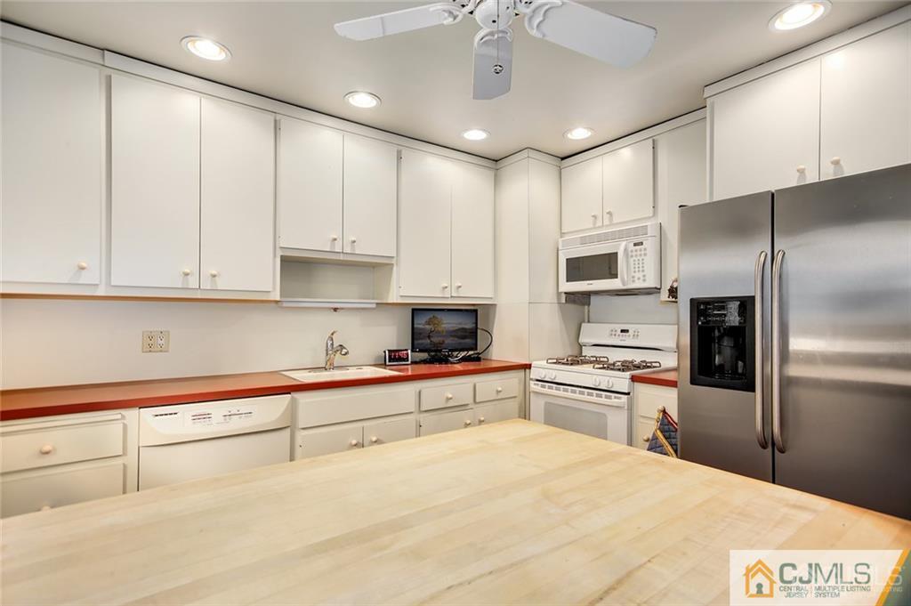 5 Steelox Road East Brunswick, NJ 08816 - Photo 9 of 24 a large kitchen with cabinets stainless steel appliances and a counter top