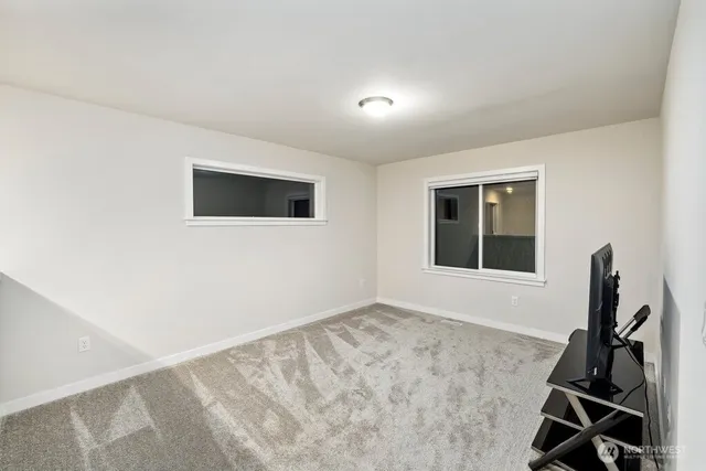 a view of workspace with wooden floor and windows