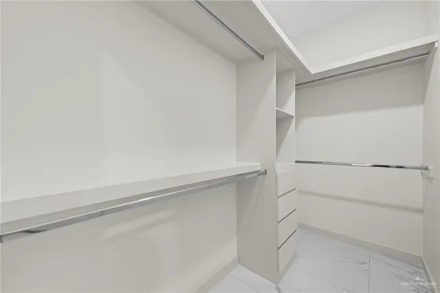 a view of an empty walk in closet