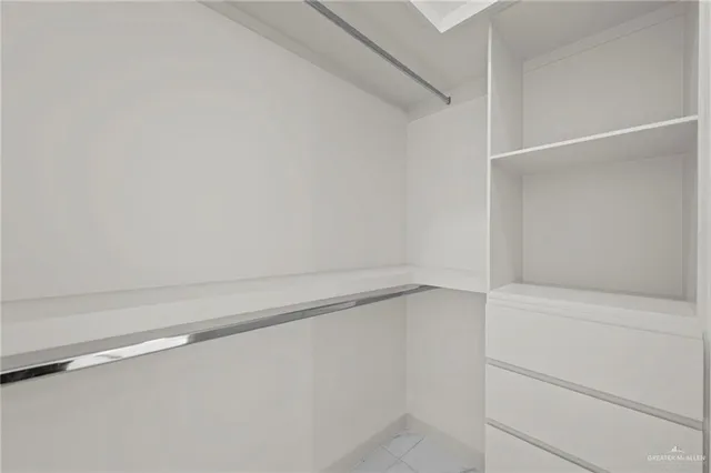 a view of an empty walk in closet