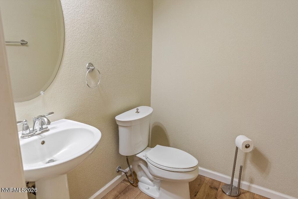 1864 Wind Ranch Road, Unit B Reno, NV 89521 - Photo 30 of 42 a bathroom with a sink and a toilet