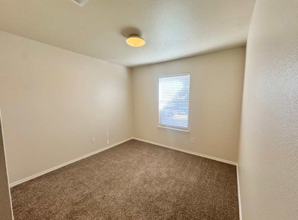 110 Comal Cove Elgin, TX 78621 - Photo 17 of 25 Bedroom 2