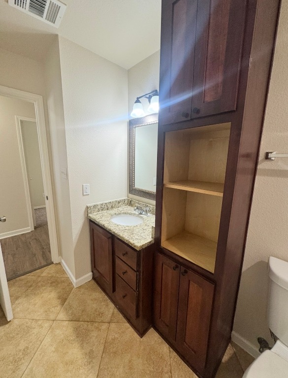 110 Comal Cove Elgin, TX 78621 - Photo 20 of 25 Bathroom with toilet and vanity