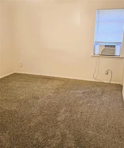 a white toilet sitting next to a bath tub