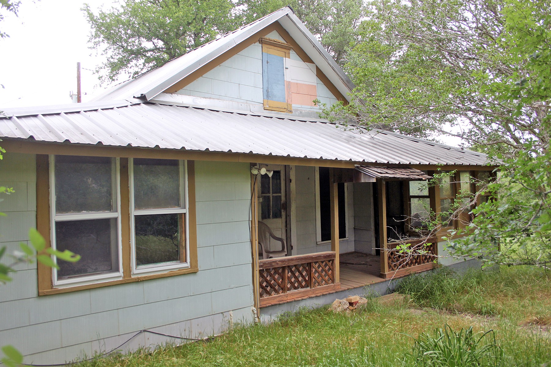 7887 Pettytown Road Red Rock, TX 78662 - Photo 1 of 26 a front view of a house with garden