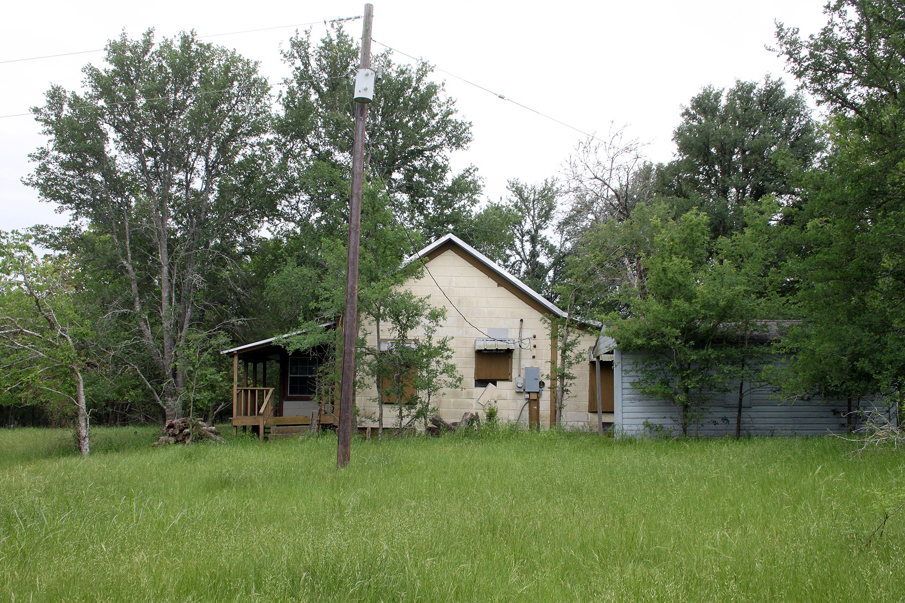7887 Pettytown Road Red Rock, TX 78662 - Photo 20 of 26 a front view of house with a garden