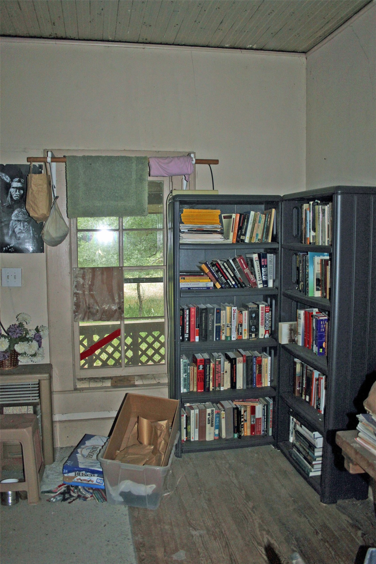 7887 Pettytown Road Red Rock, TX 78662 - Photo 24 of 26 a living room with lots of books and a book shelf