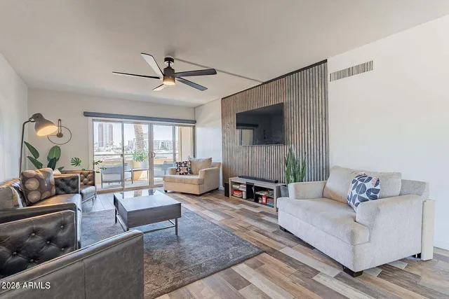 a living room with furniture and a fireplace