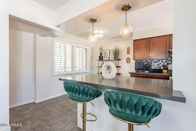 a kitchen with sink cabinets and window