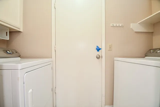 a house with a big yard and large trees