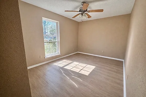 a bedroom with bed and a chandelier