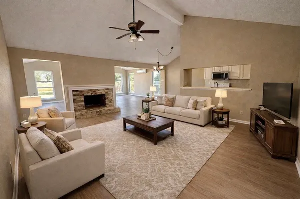 a living room with furniture and a fireplace